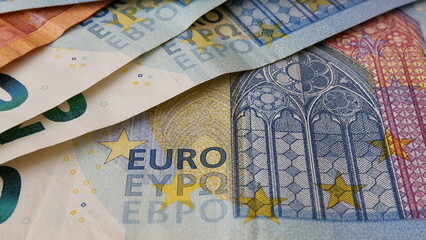 Close up view a little bit pile of banknotes or money or Euro. 