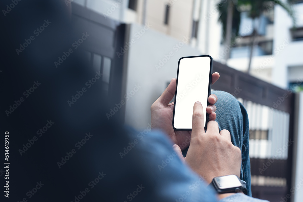 Poster mockup image of mobile phone for advertising. mock up image of man hand holding and using smartphone