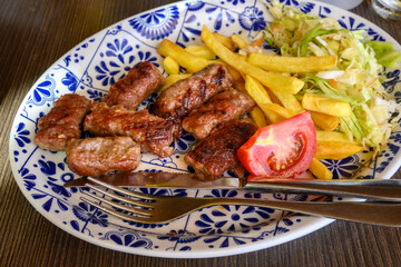 Cevapi also called Cevapсici - small sausages from chopped pork and beef with spices. Very popular dish in the Balkan countries