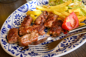 Cevapi also called Cevapсici - small sausages from chopped pork and beef with spices. Very popular dish in the Balkan countries