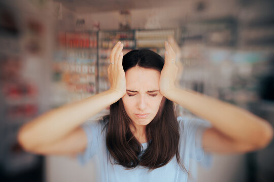 Sick Woman Suffering a Terrible Headache Entering Pharmacy for Help - Patient feeling sick having spinning head sensations and nausea
