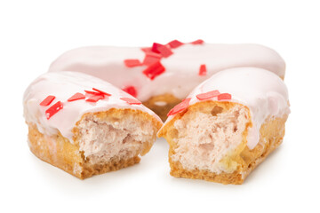 eclairs with strawberries cream fills isolated on white background