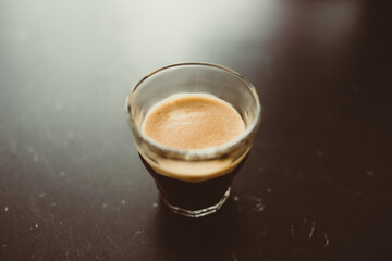 Close-up of homemade espresso coffee in glass cup