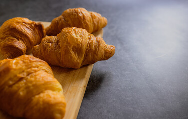 Homemade croissants on old table background.