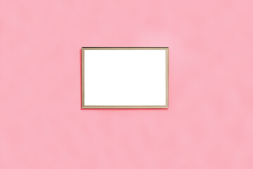Blank picture template in a wooden yellow frame to place an image or text inside on a pastel pink...