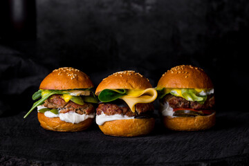 Three burgers with cutlets - obrazy, fototapety, plakaty