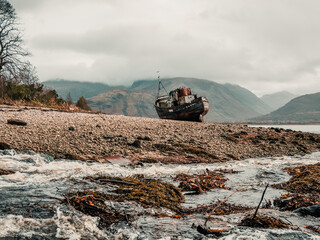 shipwreck on the beach,  Corpach Shipwreck, Old Boat of Caol with Ben Nevis in the Background, Scotland