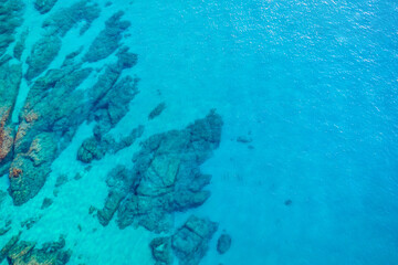 Turquoise blue sea background. Aerial view of the seascape. Conceptual background of summer beach vacations. Transparent ocean water. Tranquil, relax, relaxation, tranquility, paradise, abstract.