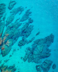 Turquoise blue sea background. Aerial view of the seascape. Conceptual background of summer beach vacations. Transparent ocean water. Tranquil, relax, relaxation, tranquility, paradise, abstract.