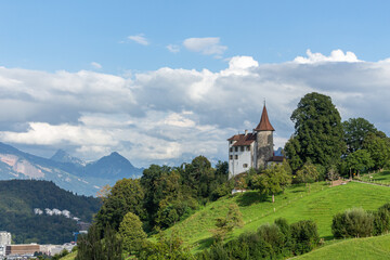Fototapeta na wymiar house on a green hill Pilatus Switzerland