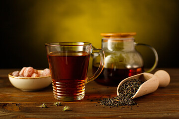 Still-life with fragrant thyme tea and a tasty sweet kumquat