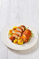 grilled chicken breasts with browned new potatoes