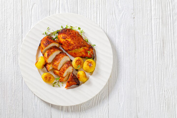 grilled chicken breasts with browned new potatoes