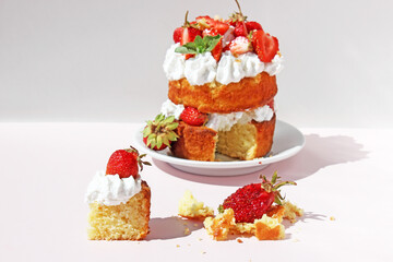 High mini cake with cream and strawberries.