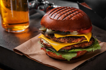 Hamburger with double pork cutlet, cheese, salad, cucumbers,