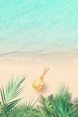 Obraz premium Top view of woman in bikini and straw hat lying and sunbathes on tropical Seychelles sea sand beach with palm tree grove. Aerial, drone view. Vertical