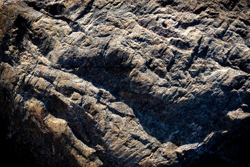 Stone background. Grey solid rocky surface. Natural uneven dark material. High quality photo