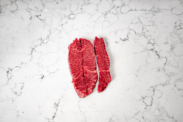 Filets of flat iron steak raw