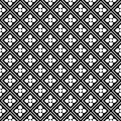 Repeated white figures on black background. Ethnic wallpaper. Seamless surface pattern design with floral ornament. Rhombuses and pentagons motif. Digital paper for textile print, web designing.
