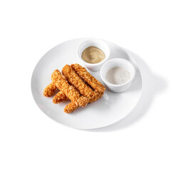Chicken sticks fried in batter in a plate with sour cream