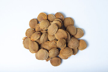 Apricot kernels on a white background. Dried apricot kernels