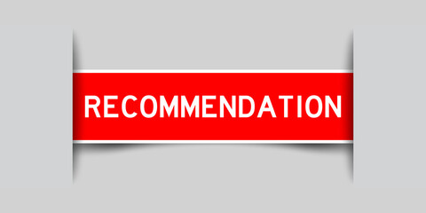Red color square label sticker with word recommendation that inserted in gray background