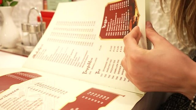 Flipping through the menu in a restaurant