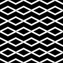 Repeated white rhombuses on black background. Ethnic wallpaper. Seamless surface pattern design with diamonds ornament. Lozenge motif. Digital paper for textile print, web designing. Vector art.