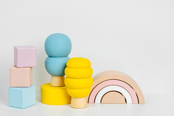 Shelf with wooden toys. Modern kids toys to play and for decorating children's room.  Games for learning and development of the child.