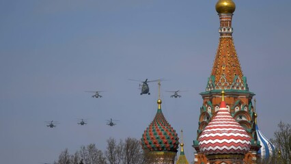 Avia parade in Moscow. Mi-26 and Mi-8AMTK helicopters fly in the sky on parade of Victory in World War II in Moscow, Russia