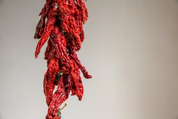 Closeup of peperoni cruschi, an air-dried crunchy sweet pepper used in the cuisine of Basilicata in Italy. Typical product of Lucan cuisine on white background. 