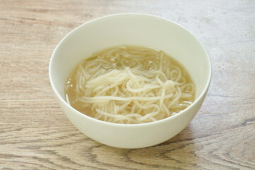 boiled Vietnamese rice noodles or Pho with soup on bowl 