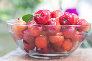 Acerola cherry or Thai cherry in a glass cup photo shoot.