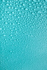 Cosmetic moisturizing liquid drops on green blue pastel background. Toner or lotion. Hyaluronic serum