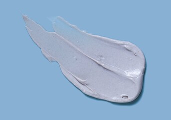 Gray cosmetic mask smudge sample texture. Mud, charcoal or  clay cleansing mask or face foam. Body slimming cream.