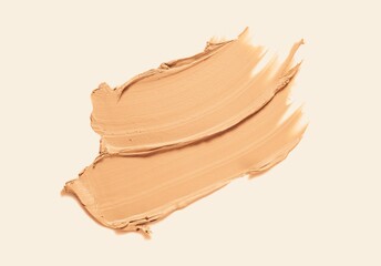 Foundation or bb cc cream and matte concealer texture swatch on beige background - obrazy, fototapety, plakaty