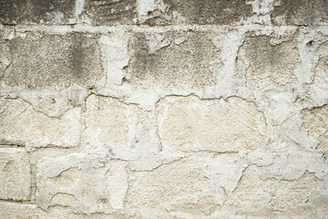 Real stone wall surface with cement. Stone background.