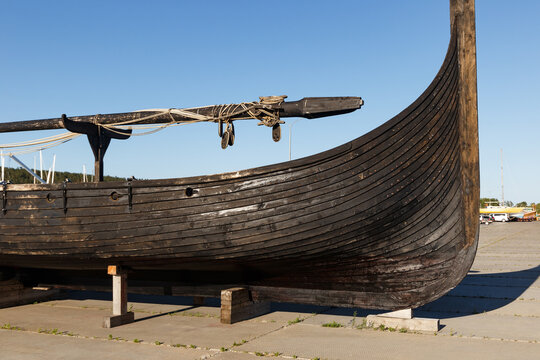 The concept of the Middle Ages. Wooden longboat of the Viking Snecchia type, close-up. Viking boat.