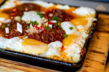 A delicious Korean dish, sizzling eggs with spicy sauce