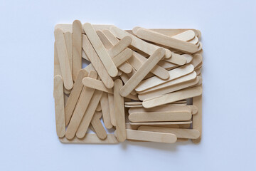 rectangle pile of wood sticks on white paper