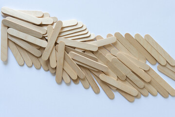 wood sticks scattered on a light background with space