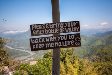 Save environment sign on Pha Daeng Peak Viewpoint, Nong Khiaw City, Laos