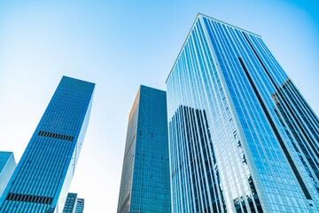 Fototapeta na wymiar Urban skyscrapers under blue skies