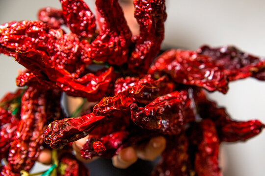 Closeup of peperoni cruschi, an air-dried crunchy sweet pepper used in the cuisine of Basilicata in Italy. Typical product of Lucan cuisine on white background. 