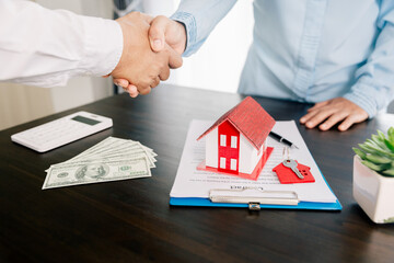 Real estate brokers or real estate agent with client or architect team Discussions about contracts , Saving money to invest in house or property in the future. Business property Concept.