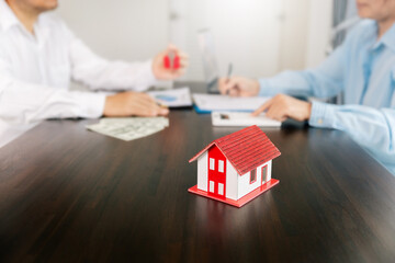 Real estate brokers or real estate agent with client or architect team Discussions about contracts , Saving money to invest in house or property in the future. Business property Concept.