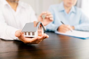 Real estate brokers or real estate agent with client or architect team Discussions about contracts , Saving money to invest in house or property in the future. Business property Concept.