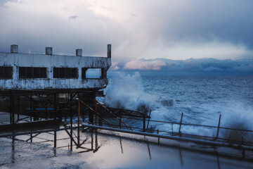 Fototapeta premium Storm at sea with waves during rain and cloudy in Alupka. Crimea