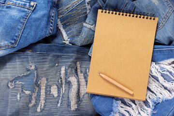 Torn jeans denim background texture. Blue Jeans fabric as material surface
