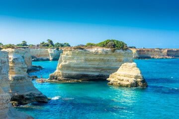 SALENTO, ITALY, 11 AUGUST 2021 The beautiful crystal clear Sea of Apulia from the cliffs and the...